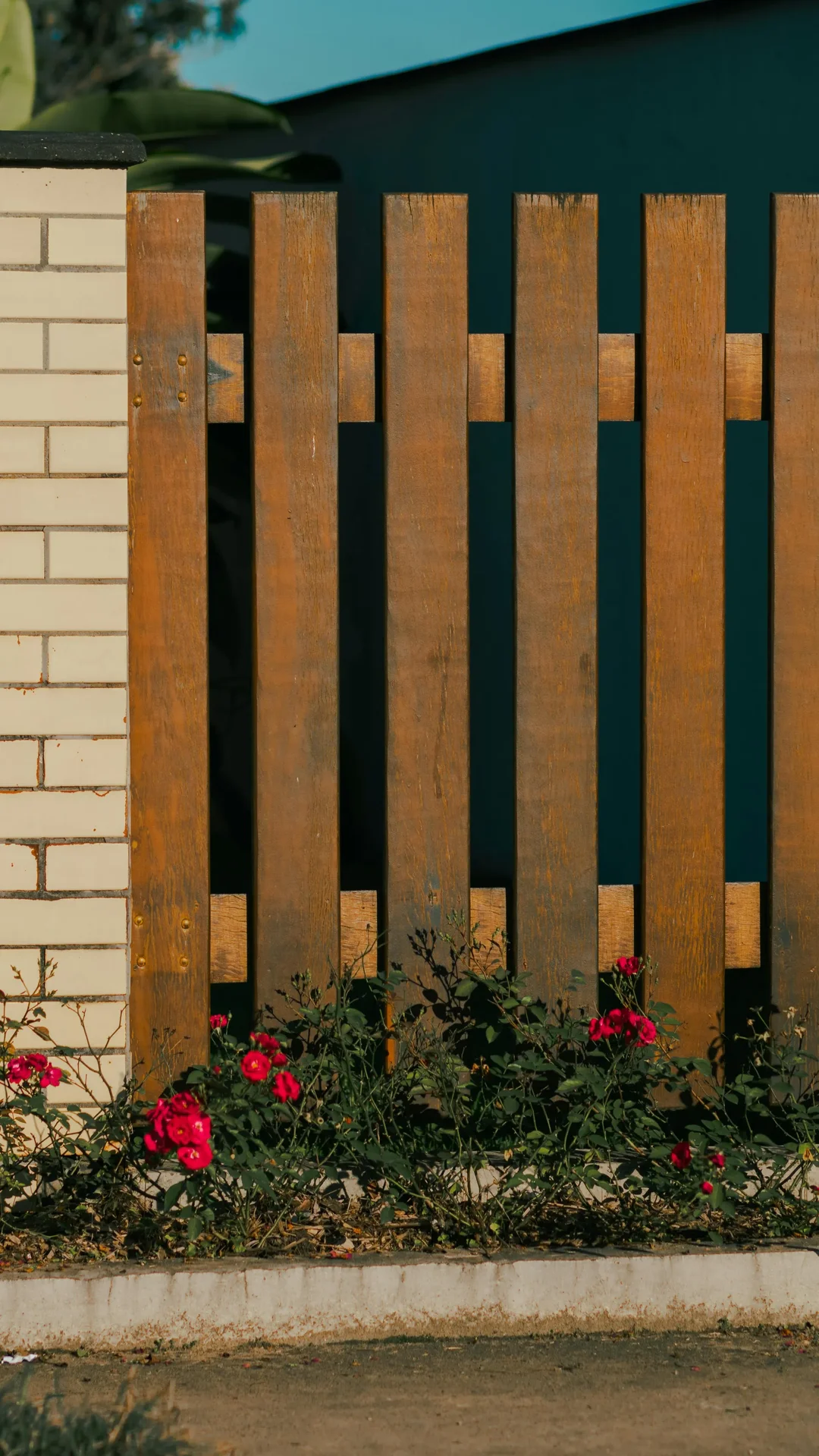 Heavy-duty custom wood privacy fence with deep concrete footings.